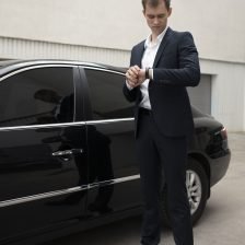 elegant-man-standing-his-car-taxi-services
